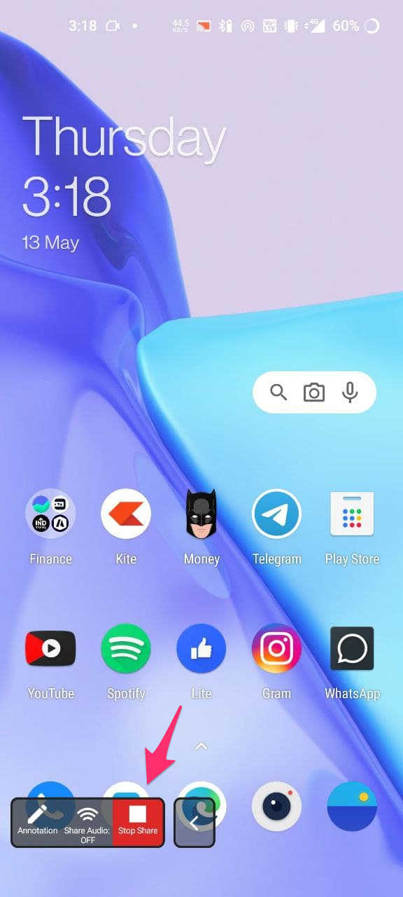 Screenshot of an Android home screen with a menu on the bottom highlighting the Stop Share button.